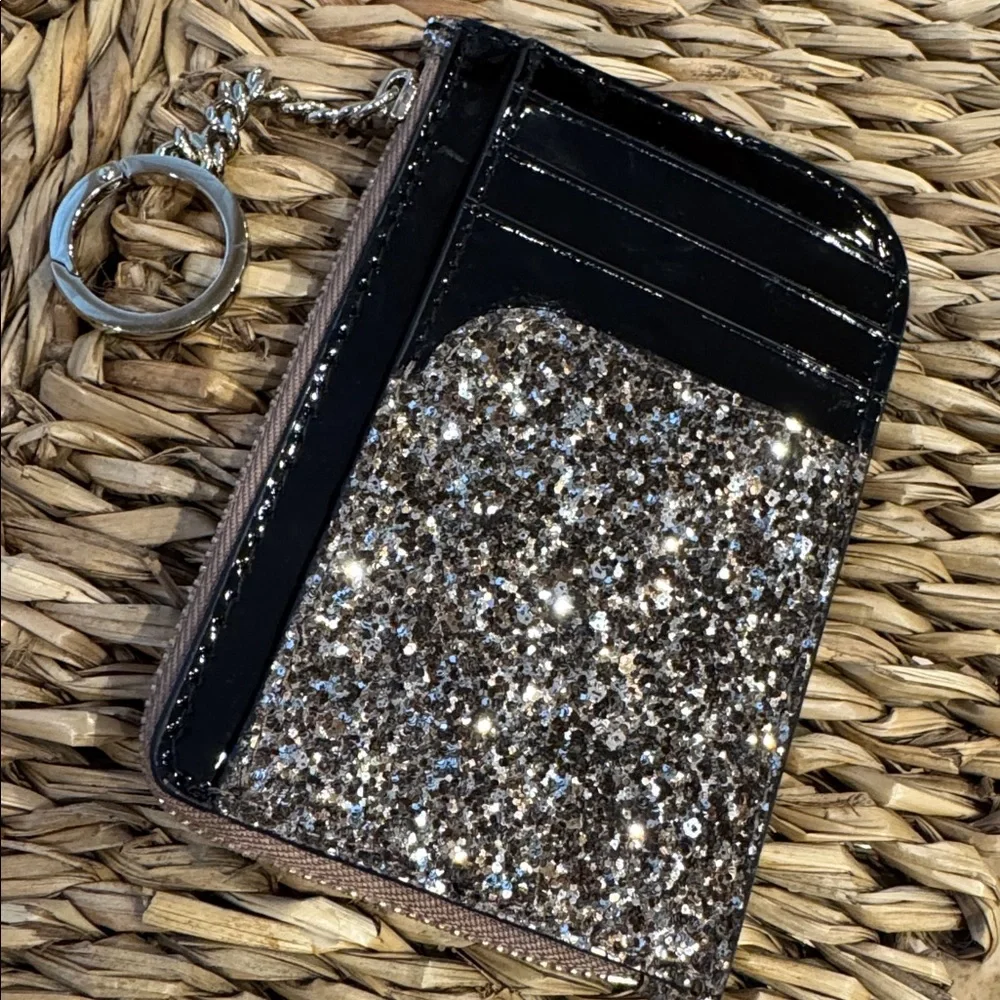 Kate Spade glitter clutch wristlet in gold and black